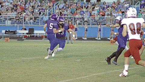 Rivercrest’s Zane Dees turns upfield after taking a handoff during a recent game. Dees ran for 80 yards and two touchdowns, had 25 yards receiving and finished with seven tackles and an interception. The Rebels picked off three passes on the night in the 22-20 win. TRIBUNE PHOTO / QUINTEN BOYD