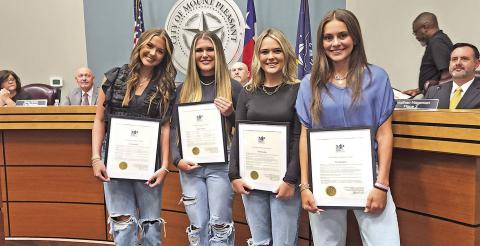(Left to right) Katy Monk, Carson Zachry, Conlee Zachry, and Ella Cross pose with their awards at the council meet TRIBUNE PHOTO / NICOLE KIMBALL