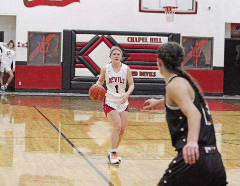 Chapel Hill’s Kaylee Tompkins brings the ball upcourt during Saturday’s home opener against Martins Mill.