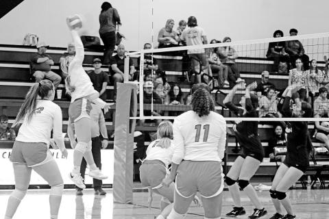 Kaylee Tompkins jumps for a spike during Tuesday’s game against Winona. The Lady Devils evened their district record at 2-2 with a 3-0 win over the Lady Cats. TRIBUNE PHOTO / QUINTEN BOYD