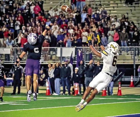 Emmanuel Harris leaps towards Cook’s pass and secures the win for Mt. Pleasant with 13 seconds left in the 4th quarter. Photo courtesy of Senior Photography Student-Andres Jaimes