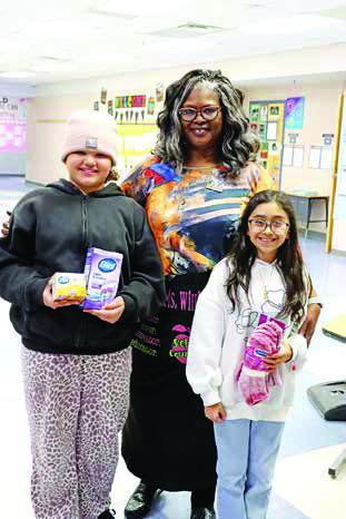 Fowler NEHS members Maryna Bean (left) and Lindsay Gonzalez (right) with Advisor Debra Williamson (center) COURTESY PHOTO
