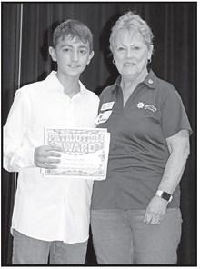 Sebastian Cates (left) receives his award from Pilot Club member, Susan Old COURTESY PHOTO