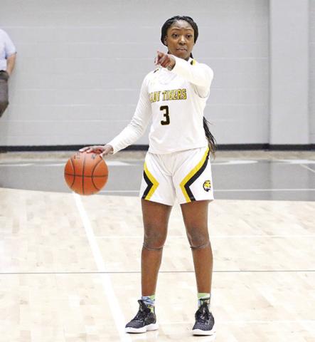 Mount Pleasant’s Paris Beard gives instructions during a recent game. Beard finished with 16 points as the ranked Lady Tigers held off Longview, 39-38, Friday evening. TRIBUNE PHOTO / QUINTEN BOYD