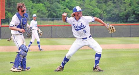 Rivercrest’s Kirk Killian prepares to throw to first for game two’s final out as Zane Dees backs him up. The Rebels defeated Alba-Golden in their bi-district series, 2-0. TRIBUNE PHOTO / QUINTEN BOYD