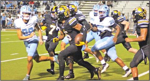 Mount Pleasant’s Makhi Grant returns a blocked extra point for two points during Friday’s game against Frisco Emerson. The Tigers fell to the state-ranked Mavericks, 62-16. TRIBUNE PHOTO / QUINTEN BOYD