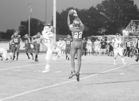 Rivercrest’s LaBroderick Rosser jumps to make a catch during a recent game. The Rebels defeated Como-PIckton Friday, 31-8. TRIBUNE PHOTO / QUINTEN BOYD