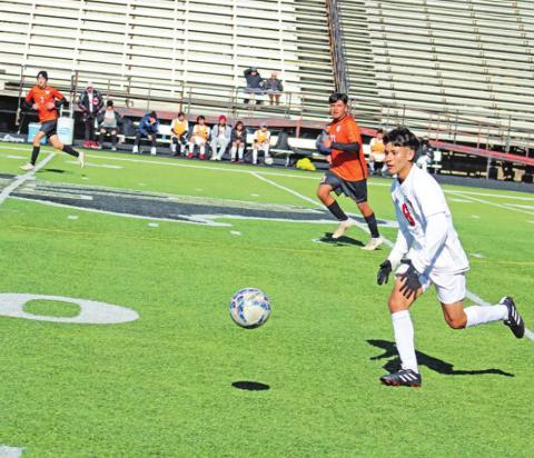 Miguel Bello chases down a loose ball during a recent Chapel Hill soccer game. TRIBUNE PHOTO / QUINTEN BOYD