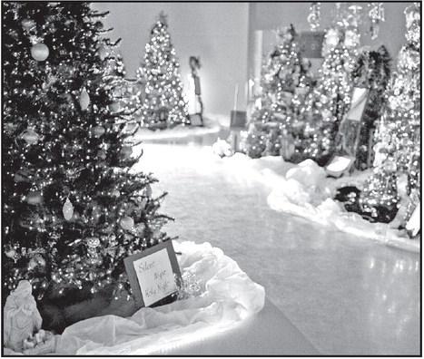 Trees at First Methodist Church depict Christmas Carols