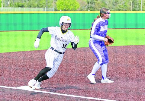 Ella Cross rounds third on her way to scoring a run during Friday’s game against Hallsville. The Lady Tigers fell just short against the Lady Cats, 6-5. TRIBUNE PHOTO / QUINTEN BOYD
