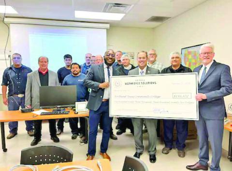 Pictured: Front row (from left) is Jimmy Smith, NTCC; Commissioner Alberto Treviño, III; Mechanic Clemente Zapata; and Dr. Ron Clinton, NTCC. Second row (from left) is: Newly Weds Foods Plant Manager George Winchester; Mechanics Andres Nava, Daniel Reames, Fernando Gonzalez; and PLC Instructor Mark Blair. Third row (from left) is Maintenance Manager Margarito Serna; Mechanics, Rudi Pastrana, Chris Pierce, Jitendra Mistry, and Jeremie Shuler. COURTESY PHOTO