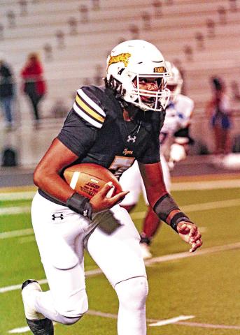 Landon Cheatham catches a pass and turns it up field. Cheatham had three catches and a touchdown for the Tigers.