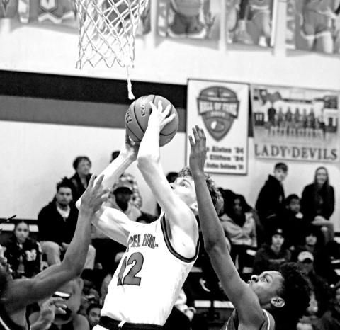 Basket For Bryce Chapel Hill’s Bryce Grissom (12) puts up a short jumper against visiting Daingerfield last week. The Red Devils, now 3-2 in District 13-3A and 14-4 overall, rebounded from the loss to the visiting Tigers to beat Hughes Springs on Friday night, 84-30.