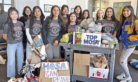 Harts Bluff ISD HOSA recently teamed together to collect cans for Titus County Cares. COURTESY PHOTO