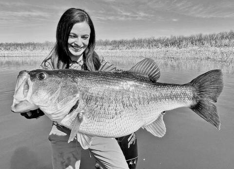 Lady angler Lea Anne Powell of Lake Jackson displays the 12- pound, 3-ounce bass she caught in February at Lake O.H. Ivie. Powell, who caught the fish on spinning rod, has submitted an application to the International Game Fish Association to have the fish certified as a 12-pound line class world record.