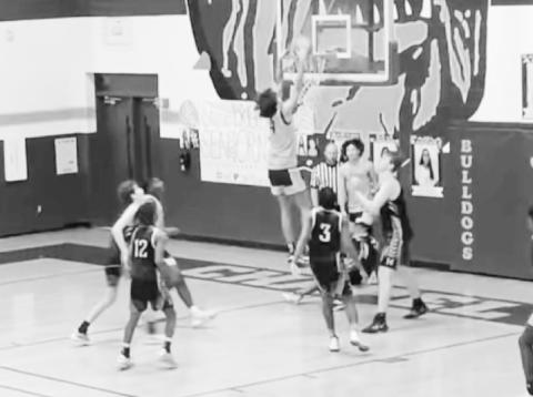 Kai Price gets his first dunk in Saturday’s scrimmage vs Nacogdoches. COURTESY PHOTO / KISHA PRICE