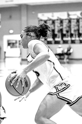Kaylin Brannon drives to the basket and scores just before half against the Lady Cats.