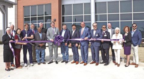 Dr. Brian Allgaier cuts the ribbon signifying the opening of CHRISTUS Health’s new emergency care center.