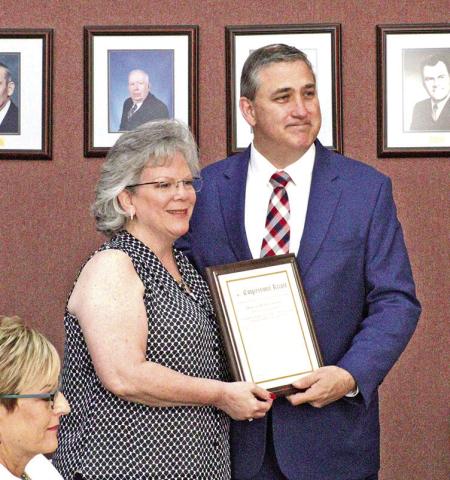 Congressman Moran presents congressional record to Susan Derrick.