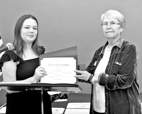 Ella Rosewell (left) receives her certificate at the DAR awards banquet COURTESY PHOTO