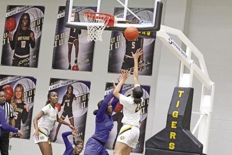 Mount Pleasant’s Morgan “Pinkie” Brooks puts up a layup during Friday’s game. The Lady Tigers remained undefeated with a 40-34 win at home over Tyler High. Mount Pleasant traveled to Whitehouse Tuesday and will host Hallsville Friday. TRIBUNE PHOTO / QUINTEN BOYD