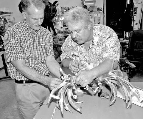 It never hurts to have more than one set of trained eyes when taping non-typical antlers with lots of abnormal growth. Some non-typical can be tricker to score than others. (Photo by Matt Williams)
