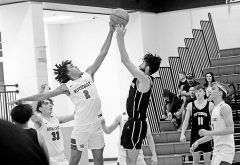 Rivercrest’s Tre Williams blocks a last-second shot attempt at the conclusion of the first overtime during the Rebels’ game against Pittsburg. The Rebels held off the Pirates, 62-61. TRIBUNE PHOTO / QUINTEN BOYD