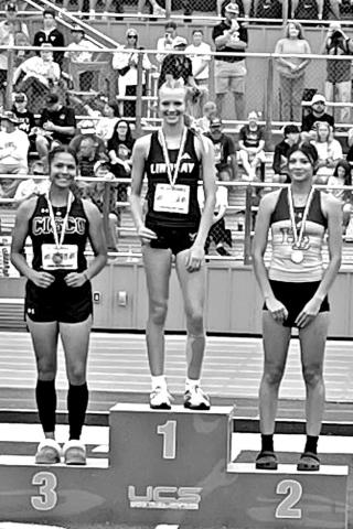 Harts Bluff junior Alexis Gonzalez (right) stands on the podium after winning a silver medal in the high jump with a height of 5-feet, 2-inches at the Class 2A, Region 2 Track &amp; Field Championships in Springtown last week. She will be competing at the UIL State Track &amp; Field Championships in Austin on May 1-3 COURTESY PHOTO