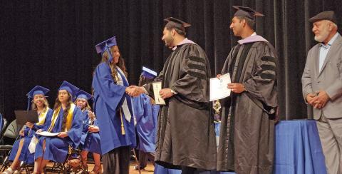 Graduates of Mount Pleasant Dental Assistant School walk the stage