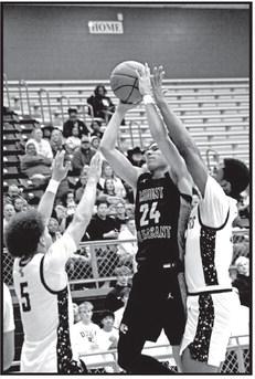 Mount Pleasant’s Carter Chism (24) puts up a shot against The Colony on Friday night.