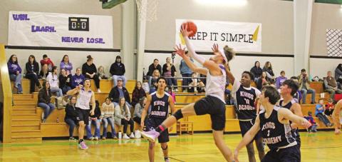 Caelan DeLisi drives for a layup during the JV game. TRIBUNE PHOTO / QUINTEN BOYD