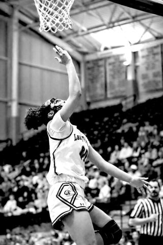 Khiya Bolton attacks the basket and scores for the Lady Tigers. Bolton scored 10 points in the district win on Saturday.