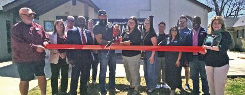 AZ Custom Buildings snip the red ribbon on March 18 COURTESY PHOTO