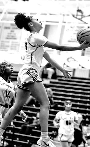 A Lady Tiger knifes through the defense, attacking the lane with confidence as Mt. Pleasant’s pressure and pace overwhelmed Nacogdoches.
