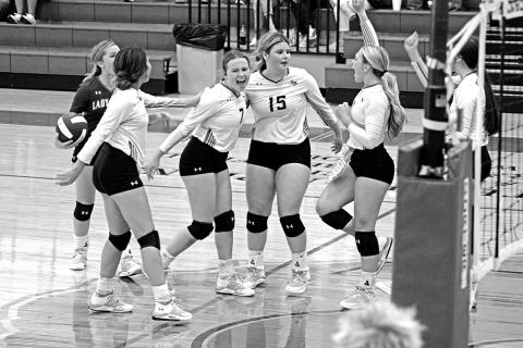 From left, Rivercrest’s Diana Kelley, Logan Huddleston, Alexis Case, Elizabeth Langehennig, Vivian Hines and Kynzie Franks celebrate a point during a recent match. The Lady Rebels took on Como-Pickton Tuesday evening and open district next week at Harts Bluff. TRIBUNE PHOTO / QUINTEN BOYD