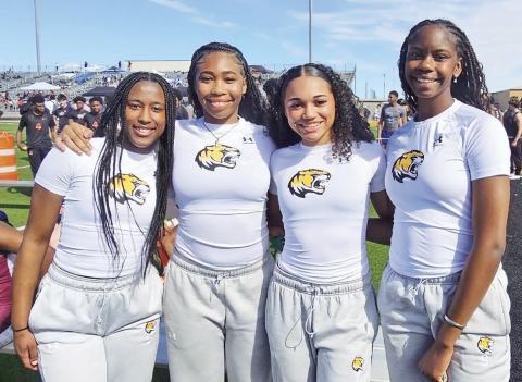 The Mount Pleasant Lady Tiger 400-meter relay squad of Tyia Allen, Shannon Hines, KK Brannon and Anna Norman took the gold medal at the Tiger Relays last week with a time of 49.5. Lady Tiger Head Track &amp; Field Coach is Travis Buchanan with assistants Crystal Jackson-James, Martina Ramirez and Jessica Stanley. COURTESY PHOTO