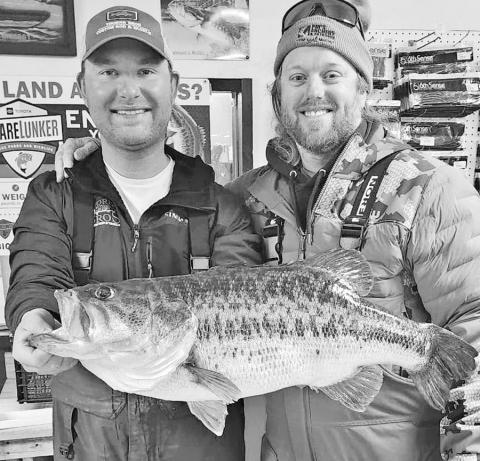 TPWD fisheries biologists discovered a PIT tag inside the 13.89 pounder that Nolan Sprengeler (left) caught on February 24 at Lake O.H. Ivie. The tag identified the fish as the same fish Jim Smith caught two years ago. It previously weighed 14.22 pounds. (PHOTO COURTESY JOSH JONES)