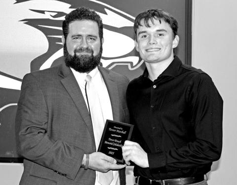 Tanner Marshall (right) receives the Trevor Broach Memorial Scholarship from PISD Athletic Director and Head Football Coach, Joey Cluley COURTESY PHOTO / SONYA WOODS AT TRICOUNTY PRESS: