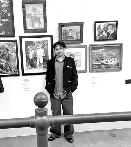 (L to R) Josue Vega standing next to The Boys now on display at the U.S. Capitol in the Cannon Tunnel
