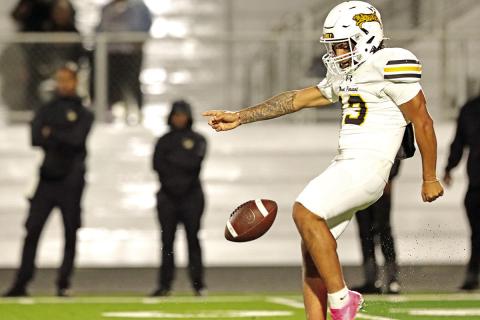 Tiger Punter Gerardo Chavez prepares to punt the ball away on 4th down.