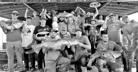 Catfishermen gather on the weigh-in stage during the 2022 Neches River Life event, where $$4,500 was awarded to the winners. This year’s event is set for April 14-15. COURTESY PHOTO / DAVID HOLLAND