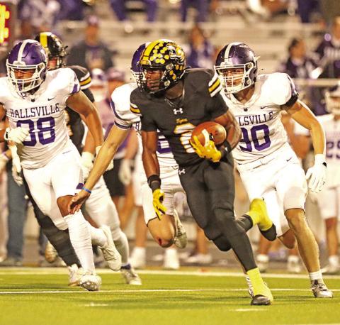 Decorian Thompson makes a move after securing the pass. Thompson surpassed 1,000 yard receiving mark during the win over Hallsville.