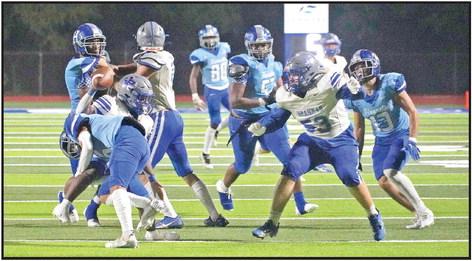 Pewitt’s Junie Johnson is brought down after a gain during Friday’s game at Hooks. BEE PHOTOS / TONY BASSO