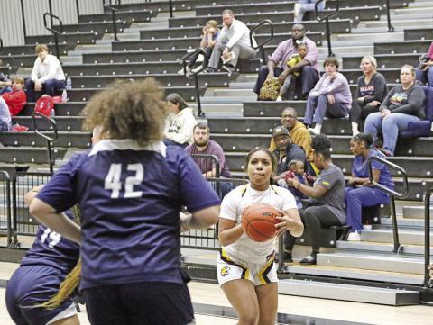 Mount Pleasant’s Ja’Yani Shannon prepares to put up a shot during a recent game. The Lady Tigers, ranked 13th by tabchoops. week. org and fifth by txhsgbb.com, hosted Whitehouse Tuesday and will take part in the Hallsville Tournament next TRIBUNE PHOTO / QUINTEN BOYD