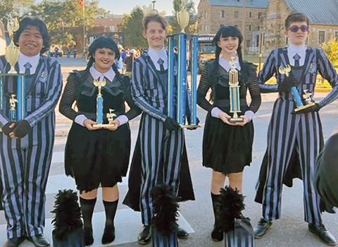The MPHS Goin’ Gold Band Drum Majors and Color Guard officers with their trophies L to R: Jose Fuentes, Jocelyn Marroquin, Shpat Zeqaj, Addison Heeren, Orion Senence COURTESY PHOTO