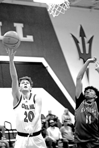 Chapel Hill’s Max Daniel (20) goes in for a lay-up during a recent home game.