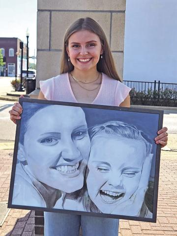 18-year-old Brianne Davis proudly shows her award-win-See ning talents TRIBUNE PHOTO / NICOLE KIMBALL