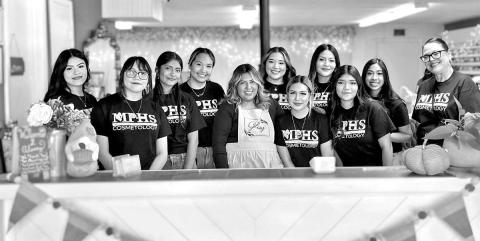 Senior Cosmetology students at Glossy Nail Lounge (L to R) Lesly Canada, Bryanna Nava, Jennifer Pena, Raquel Martinez, Glossy Nail Lounge owner Ellie Ruiz, Tania Rangel, Perla Gaytan, Vanessa Ramirez, Yoselin Lopez, Amy Carrillo, MPHS Cosmetology instructor Aleshia Rivera COURTESY PHOTOS