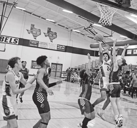 Kamryn English soars for a layup during Rivercrest’s tournament game against Jefferson. TRIBUNE PHOTO / QUINTEN BOYD