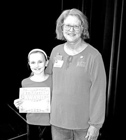 Anna Henry (left) receives her award from Pilot Club member, Becky Meriwether Courtesy Photo